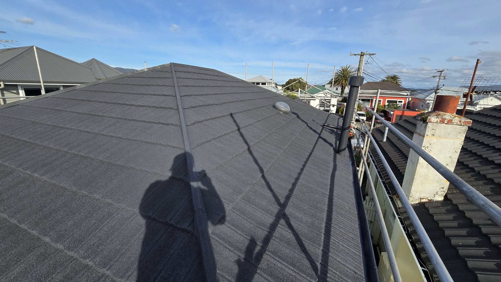 White house with dark grey tiled roof